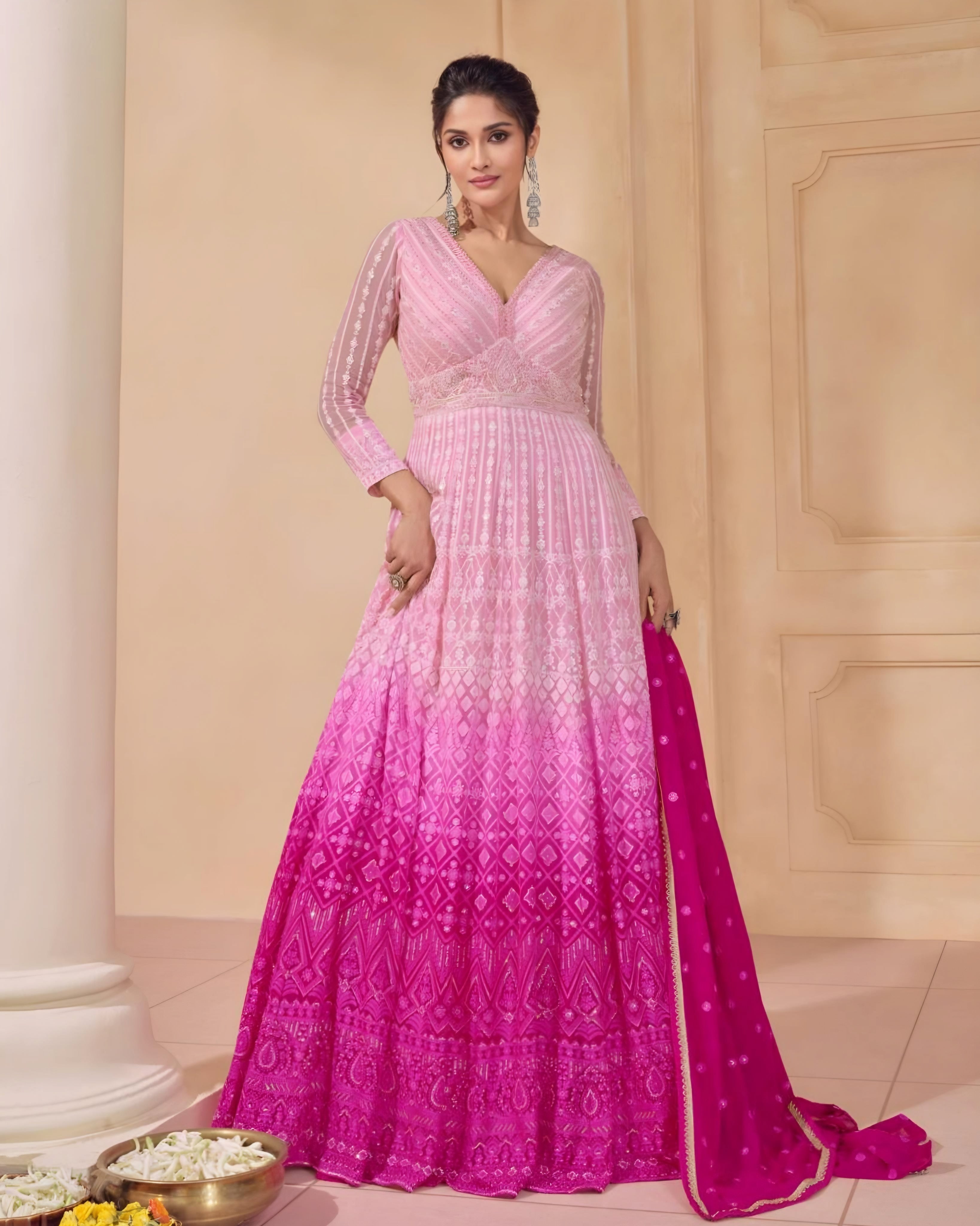 Pink ombre Anarkali gown with delicate embroidery, sheer sleeves, and matching pink dupatta, ideal for weddings, festivals, and special events, available at Sakhi Fashions