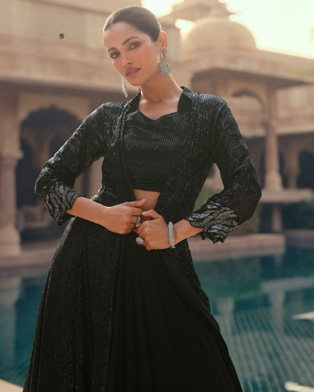 Close-up view of the chic black sequin lehenga set, highlighting the intricate sequin detailing on the crop top and lehenga.